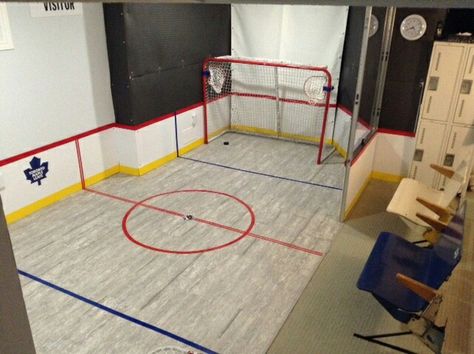 Hockey / Shooting / mini sticks area created for our daughter, in a finished basement. Minimal impact on finished portion,  easily restored to original finish for later use. Mini Sticks Hockey Room, Mini Hockey Stick Storage, Hockey Playroom, Finished Basement Storage, Hockey Garage, Basement Hockey, Hockey Stick Storage, Hockey Basement, Organize Playroom