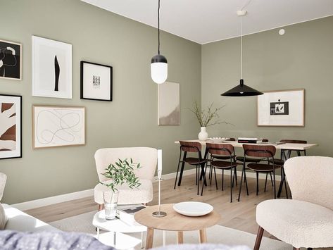 Light flooded home with pale green walls - COCO LAPINE DESIGNCOCO LAPINE DESIGN Green Walls Living Room, Sage Green Living Room, Black Round Dining Table, Light Green Walls, Black Furniture Living Room, Green Dining Room, Walnut Dining Chairs, Coco Lapine Design, Sage Green Walls