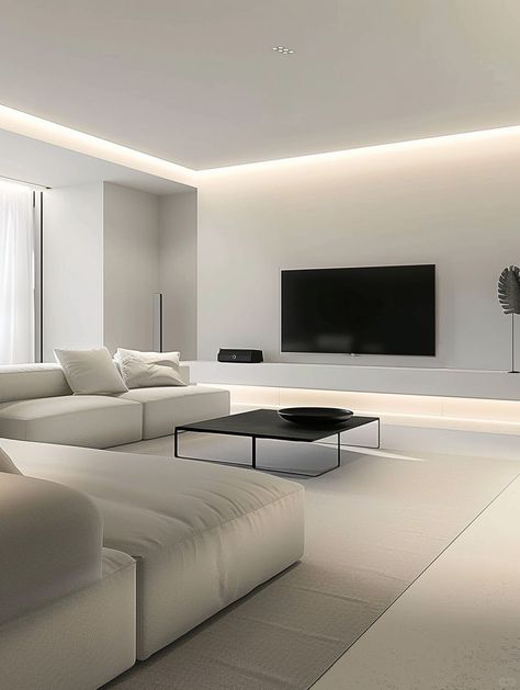 This minimalist decoration takes simplicity and grandeur as its core.
With white as the main color,
The light gray tone of the walls and ceiling is used as a supplement.
Together they create a bright and spacious visual effect.
The combination of TV and black low coffee table,
Not only practical and modern,
At the same time, the use of black elements also enhances the sense of stability in the space. Clean Minimalist Living Room, Low Ceiling Design, Minimalist Tv Wall, Low Ceiling Living Room, Barang Aesthetic, Minimalist Living Room Apartment, Minimal Living Room, Low Coffee Table, Dream Apartment Decor