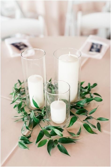 centerpiece idea, candles, greenery, italian ruscus Vineyard Wedding Reception, Green Wedding Centerpieces, Early Spring Wedding, Beautiful Wedding Centerpiece, Cheap Wedding Decorations, Simple Wedding Flowers, Wedding Motifs, Simple Wedding Centerpieces, Rustic Wedding Decorations