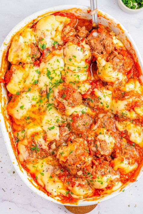 Cheesy Meatball Casserole - 🧀🎉👏🏻 An EASY comfort food casserole that's made for meat and cheese lovers! Loaded with juicy baked meatballs and topped with both mozzarella and Parmesan cheeses for a true family FAVORITE casserole! No noodles, no problem. My homemade meatballs are incredible but you can use frozen meatballs to save time on busy weeknights when you need to get dinner on the table in 45 minutes! Cheesy Meatball Casserole, Comfort Food Casserole, Family Favorite Casseroles, Meatball Casserole Recipe, Favorite Casserole Recipes, Cheesy Meatballs, Baked Meatballs, Meatball Casserole, Favorite Casseroles