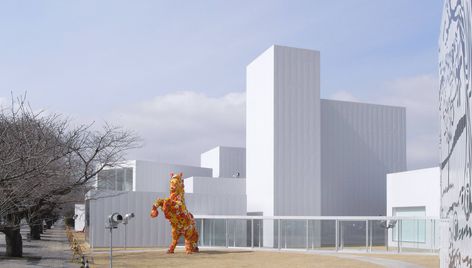 The Towada Art Center by SANAA is an exploration of fragmented architecture, where 16 pavilions connected by a glass corridor redefine spatial relationships and urban interaction in Aomori, Japan. Glass Corridor, Aomori Japan, Tokyo Guide, Ryue Nishizawa, Japan Guide, Spatial Relationships, Aomori, Urban Fabric, Kanazawa