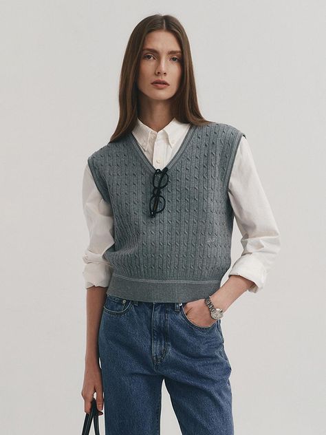 Our season-to-season, classic and cozy knit vest. Designed to be worn layered or alone, this piece features a multicolor fabric.We just want to reach out and touch this perpetually cozy-chic vest. - V-neck and relaxed fit vest- Classic design and ribbed hem- Color block design on the neck, arm hole and hem - Our vest is also soft and cozy with rayon blend- It looks as good in the office as it does out. Taffy Candy, Gray Vest, Cable Knit Vest, Grey Vest, Color Block Design, Cozy Chic, Cozy Knit, W Concept, Block Design