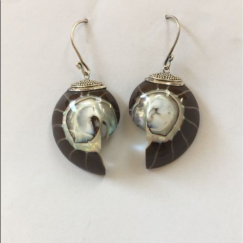 These Nautilus Bronzite & Mother Of Pearl Earrings Have A Sterling Silver Cap And Fish Hooks Ear Wires. The Total Length Of The Earring Is Approx. 2 1/8” Long And The Shell Itself Takes Up About 1 1/4” Of That. I Have 3 Sets Of These Earrings And They Very Slightly. At The Time Of This Listing I Also Have A Matching Necklace Listed. As With All My Listings, This Is New Never Worn. Thank You For Your Interest. Snail Shell Earrings, Silver Shell Dangle Earrings, Bohemian Silver Shell Earrings, Abalone Shell Dangle Earrings With Matching Set, Metal Shell-shaped Earrings, Vintage Mother Of Pearl Shell Jewelry, Coco Chanel Quotes, Mother Of Pearl Earrings, Silver Caps