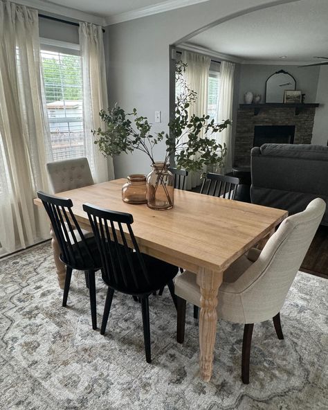 I’m amazed at how the right furniture and decor can brighten up a space. This kitchen/dining area feels light and welcoming. Swipe to see the before 😊 #interiordesign #homedecor #homedecoration #interiordesigner #decorideas #smallbusiness #blackownedbusiness #modernorganic #moodboard #interiordesignnola #myspoak #vintagedecor #vintage #pantone #coloroftheyear #livingroomdecor #modernvintage Wood Table Gray Chairs, Dark Wood Dining Table Grey Chairs, Gray Wash Dining Table With Black Chairs, Medium Oak Cabinets, Gray Chairs For Dark Color Dinning Table, Black Dining Toom Chairs Gray Table, Grey Floor, Gray Cabinets, Grey Flooring