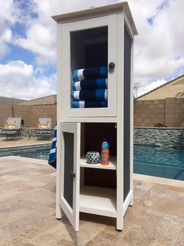 Storage Ideas For Towels, Pool Storage Ideas, Pool Towel Storage, Beach Towel Storage, Pool Organization, Pool Towel Holders, Pallet Deck Diy, Pool Toy Storage, Poolside Furniture