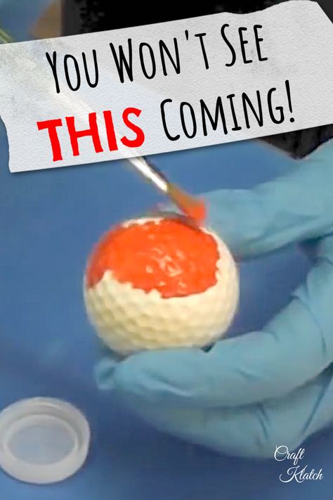 white golf ball being pained orange with a paint brush Golf Ball Decor, Upcycle Golf Balls, Crafts With Golf Balls, Golf Balls Crafts Ideas, Golf Diy Crafts, Painted Golf Balls, Golfball Crafts, Golf Diy Gifts, Golf Diy Projects