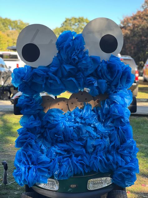 Dollar store supples make this adorable cookie monster gold cart (plastic tablecloth, poster board, pool noodles) Cookie Monster Backdrop, Gold Cart, Monster Classroom, Giant Cookie, Backdrop Decor, Pool Noodles, Plastic Tablecloth, Classroom Door, Halloween Stuff