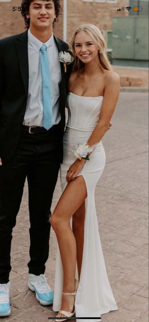 White prom dress cream strapless leg slit corset top White Long Hoco Dress Tight, Hoco Dresses Matching Date, Non Basic Prom Dress, White Dress Prom Couple, Homecoming Couple Ideas, Prom Couples White Dress, White Homecoming Dress Couple, White Prom Dress Couple Pictures, Preppy Prom Dresses Long