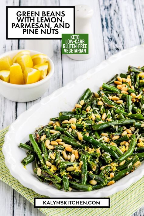 Pinterest image showing white serving dish containing Green 
Beans with Lemon, Parmesan, and Pine Nuts with a small bowl of lemon wedges behind. Grilled Green Bean Recipes, Green Beans With Lemon, Atkins 20, Grilled Green Beans, Stir Fry Green Beans, Stir Fry Greens, Pine Nut Recipes, Lenten Recipes, French Green Beans