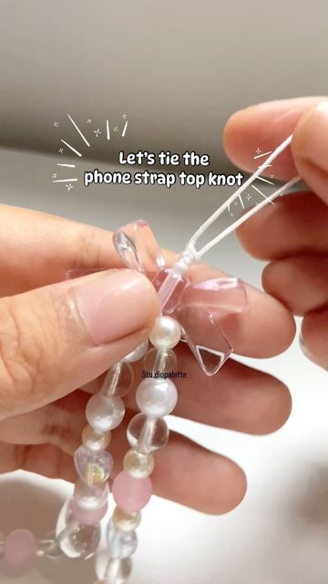 Studio.Palette on Instagram: "💕Phone strap top knot tutorial🫢

This one gives the most neat finishing in my humble😌opinion.

Tutorial:
1. Tie the strings once.
2. Make two loop one bigger than the other.
3. Wind the end of the bigger loop around both the strings 4 -5 times
4. Then pass it through the smaller loop
6. Pull the end of the small loop and tighten.
7. Arrange it and tighten some more. Then once you are sure its secure and tight snip the ends✂️✂️ 

and you are doneeeee.

You can glue down the ends or melt it using a lighter but I dont think it’s necessary. It’s quite sturdy and tight and wont easily come off." How To Tie Phone Strap, How To Tie Two Strings Together, Top Knot Tutorial, Instagram Phone, Knot Tutorial, Loop Knot, Graphic Novel Art, Bracelet Knots, Phone Strap