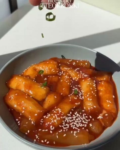 vegan recipe on Instagram: "🤤 📣 "Get 200+ delicious vegan recipes Cookbook for a healthier lifestyle" LINK IN BIO 🔗 @tastyofvegan 1️⃣ or 2️⃣? What recipe do you like the most? by @Itsvegansis 1️⃣ RICE PAPER TTEOKBOKKI🔥 // full recipe ↓ No store bought rice cakes? No problem! Just use rice paper instead! This cheese stuffed tteokbokki is so easy to make and ridiculously delicious🥵 INGREDIENTS: - ≈20 rice paper sheets - 200g vegan mozzarella cheese - 1 cup vegetable broth - ½ tbsp gochujang - 1 tsp gochugaru - 1 tsp sweetener - Sesame seeds & scallions for garnish INSTRUCTIONS: 1. Cut the vegan mozzarella into sticks. 2. Dip rice paper in a bowl of cold water, place it on a wooden board and add one mozzarella stick to the bottom of the sheet. Fold over the sides and roll. Repeat until Rice Paper Tteokbokki, Vegan Mozzarella Cheese, Mozzarella Stick, Vegan Mozzarella, Plant Based Cookbook, Vegan Lunch Recipes, Vegetable Broth, Cheese Stuffed, Vegan Lunch