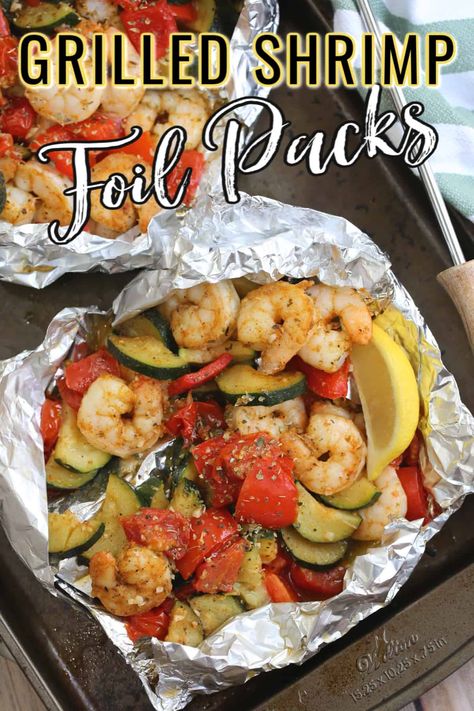 These easy GRILLED SHRIMP FOIL PACKS are loaded with shrimp, zucchini, peppers, tomatoes and tasty spices. Made on the BBQ or oven, cleanup is a breeze! #foilpack #shrimp #grilledshrimp #bbqshrimp #foilpackrecipe Shrimp Foil Packs, Shrimp Foil Packets, Shrimp Boil Foil Packs, Easy Grilled Shrimp Recipes, Shrimp Boil Foil, Food Specials, Shrimp Zucchini, Foil Packet Dinners, Foil Pack Meals