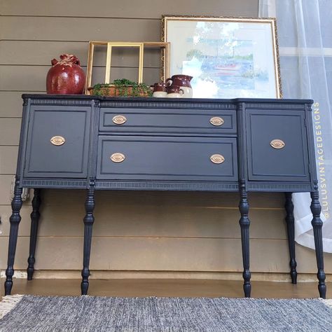 ✨️Now Available✨️ The holiday season is fast approaching, and what better addition to your home than this grand buffet that you can use to showcase all your delicious meals. The top has been refinished and sealed with a satin polyurethane for extra protection. Body is painted in a matte black finish. 66"L X 40.5"H X 22"D DM me with inquiries. . . . . . . . #lulusvintagedesigns #buffet #paintedfurniturelove #blackpaintedfurniture #furniturestore #atlantafurnituresale #atlantaartists Antique Black Cabinets, Sideboard Entryway, Black Credenza, Entryway Christmas, Black Painted Furniture, Furniture Sales, Buffet Sideboard, China Cabinets, Furniture Redo