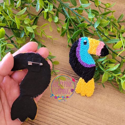 After buying it's earrings, necklace, brooch, and making coasters and jewelry rugs, I also made a bag brooch for myself while wondering what else I could do with a toucan. You can call it lucky charm 🤭 If you want, I can make one for you too. 🙃 #toucandoit #punchneedle #modernpunchneedle #cutedesign #bagbrooch #toucanbird #toucan #toucansymbolism #777 #toucancoaster #luckycharm #toucancharm #toucanbrooch #punchneedleembroidery #punchneedleart Making Coasters, Bag Brooch, How To Make Coasters, Needle Embroidery, Punch Needle Embroidery, Needle Art, Punch Needle, Lucky Charm, A Bag