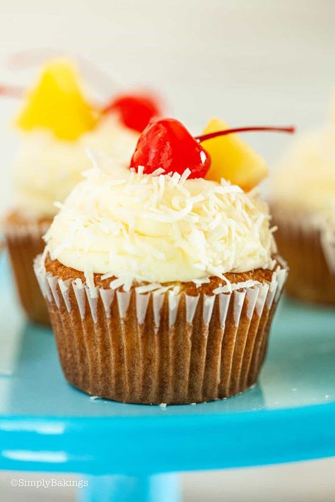 Try this easy-to-bake and delicious Pina Colada Cupcakes topped with coconut frosting for parties, picnics, snacks or potlucks. You will love the delicious taste of pineapple and coconut flavor combination in every bite! Homemade Pina Colada, Pina Colada Cupcakes, Hawaiian Desserts, Pineapple Cupcakes, Best Christmas Desserts, Easy Cupcake Recipes, Coconut Frosting, Cake Studio, Easy Cupcakes