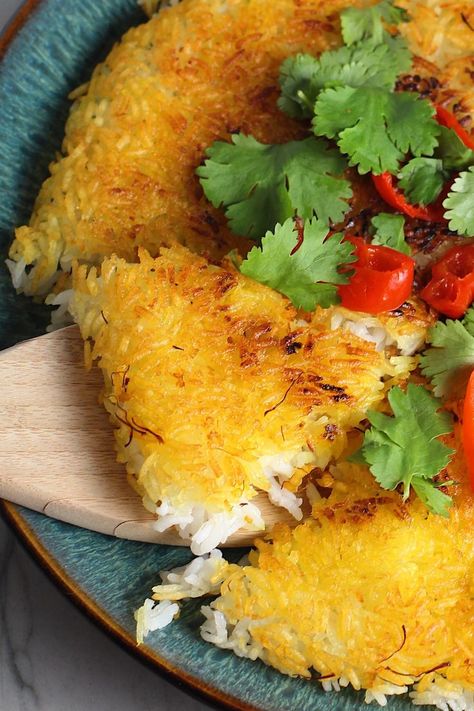 This Saffron Butter Crispy Rice recipe is easy and full of flavor and texture. It's based on a traditional Persian dish. The saffron brings that slightly sweet, floral note and gives that beautiful yellow-orange color. Added to the butter is what gives this crispy rice the buttery, crispy bottom that is irresistible. It’s simple to make and perfect for a family dinner side! #ricerecipes #sidedishes #familydinnerideas #crispyrice What To Serve With Sliders, Saffron Butter, Crispy Rice Recipe, Rice Crispies Recipe, Yellow Rice Recipes, Easy Spring Recipes, Delicious Family Dinners, Seasoned Veggies, Dinner Side