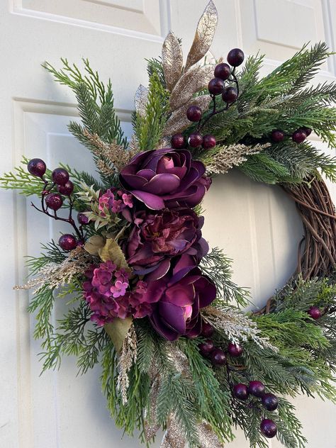 Elegance and radiant beauty are the main two elements of this design, crafted for the holiday season. Celebrate Christmas and ring in the new year with this glamorous and lush burgundy and gold roses wreath. This wreath shines by itself and adds a touch of class to your front door. The wreath can be used indoor over a mantle, kitchen cabinets, or even your bed.  The possibilities are endless. Free Shipping within the US Width: 20" Height: 20"  Depth : 3" **All wreaths are best kept out of the el Christmas Wreaths For Front Door Rustic, Wreath Over Bed, Christmas Reath, January Wreath Ideas, Elegant Christmas Wreaths, Purple Christmas Wreath, Elegant Christmas Wreath, Christmas Wreath Designs, Holiday Door Wreaths