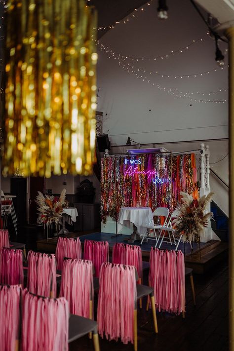 Pink, orange, gold and silver metallic streamer backdrop with pink streamers on the back of chairs, gold streamers on the lights and fairly lights hung up on the ceiling Pink Streamers, Gold Streamers, Cat Stephens, 36 Birthday, Wedding Streamers, Wedding Diys, Orange And Pink Wedding, Festival Style Wedding, Disco Wedding