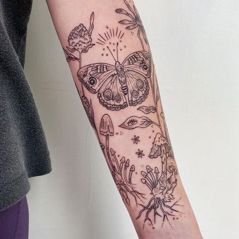 Black Lined Tattoos, Whimsical Fairy Tattoo Sleeve, Eye Flowers Tattoo, Buckeye Butterfly Tattoo, Mushroom And Butterfly Tattoo, Cottage Core Tattoo Sleeve, Mushroom Butterfly Tattoo, Mushroom Eye Tattoo, Mushroom Fairy Tattoo