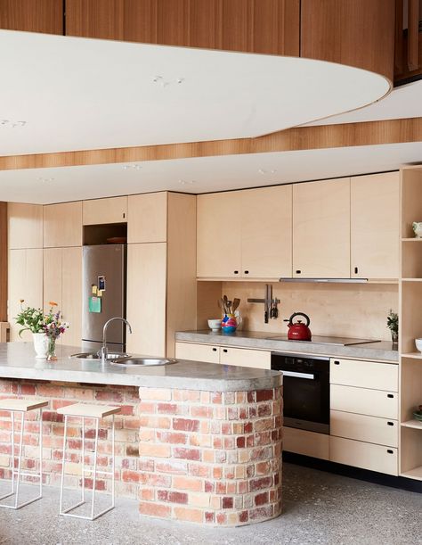 A unique, rounded island bench, recycled bricks below and concrete benchtops. ‘It’s a very raw, warm and workmanlike space – albeit wrapped up in curves!’ Brick Kitchen Island, Rounded Island, Curved Kitchen, Recycled Brick, Brick Kitchen, Island Bench, Tuscan Design, Tuscan Decorating, Kitchen Benches