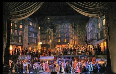 Giacomo Puccini's "La Boheme" starring Angela Gheorghiu. Even if you know nothing about opera, you've probably heard of "La Boheme." The plot is simple: There's a group of bohemians living in Paris around 1830. Two of them fall in love, and from there tragedy ensues. It's Puccini's music that has made this such an endearing classic. It's romantic and easy on the ears - a great introduction to opera. I chose this particular production simply because the sets are AMAZING. La Boheme Opera, Met Opera, Theatre Set Design, Metropolitan Opera House, Opera Theatre, A Night At The Opera, Set Design Theatre, Stage Set Design, Elegant Bohemian