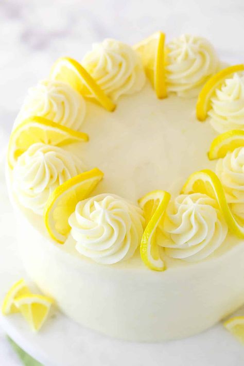 This lemon layer cake is bursting with real lemon flavor. Fresh lemon juice is baked into three layers of fluffy vanilla cake that are filled and frosted with vibrant lemon cream cheese frosting. Homemade Lemon Cake Recipe, Best Lemon Cake Recipe, Lemon Birthday Cakes, Homemade Lemon Cake, Lemon Curd Cake, Lemon Layer Cakes, Lemon Cream Cheese Frosting, Lemon Curd Filling, Cake Simple