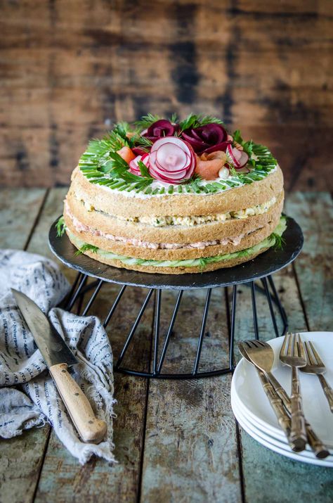 A Smörgåstårta is a savoury sandwich cake from Sweden. This recipe uses delicious fillings and clever garnishes to create a beautiful savoury cake. Swedish Salmon, Swedish Sandwich, Sandwich Cakes, Sandwich Torte, Cake Sandwich, Salad Cake, Springform Pan Cake, Egg Salad Sandwiches, Leftover Cake