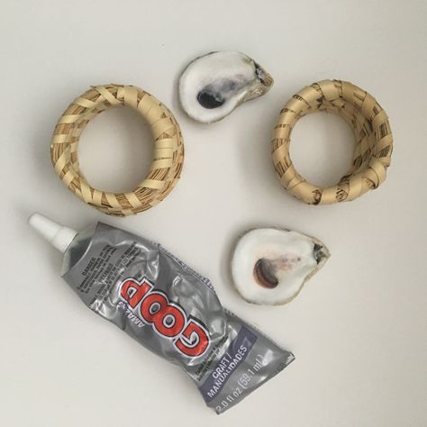 Oyster Shell + Sweetgrass Napkin Rings Oyster Napkin Rings Diy, Oyster Shell Napkin Rings Diy, Oyster Shell Place Cards, Oyster Shell Table Numbers, Oyster Napkin Rings, Oyster Shell Jewelry Holder, Decoupage Oyster Shell Napkin Rings, Napkin Rings Diy, Nautical Diy