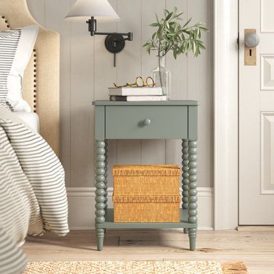 Invite traditional style into your bedroom or guest room with this nightstand. It's made from wood and is available in several finishes, so you can select the one that best complements your aesthetic. We especially love the elegant turned legs in classy spindle shapes. A single drawer provides lots of space for the TV remote and nighttime essentials. And you can tuck your stack of must-reads on the lower open shelf. Birch Lane™ Color: Green Birch Lane™ Benbrook 1 - Drawer Spindle Nightstand - Ni Birch Lane Bedroom, Colorful Bedside Table, Sage Green Nightstand, Spindle Nightstand, Colourful Bedside Table, Green Nightstand, Green Nightstands, Painted Tables, Vintage Inspired Rugs