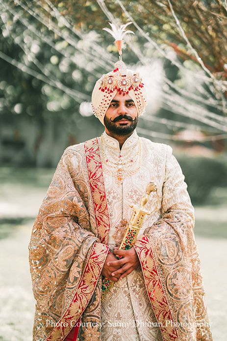 groom in Off-white sherwani with an elaborate Kalgi and Mala Punjabi Sherwani, Sikh Groom, Rimple And Harpreet Narula, Sherwani, The Groom, Off White, Wedding Dress, White