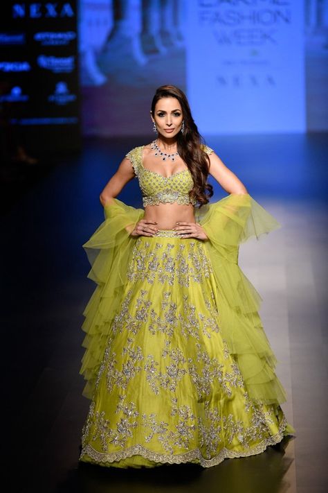 Malaika Arora in a lime green ruffles Anushree Reddy lehenga. #frugal2fab Lime Green Lehenga, Appliqué Flowers, Ruffle Trend, Half Saree Lehenga, Anushree Reddy, Organza Lehenga, Lehnga Dress, Indian Men, Malaika Arora