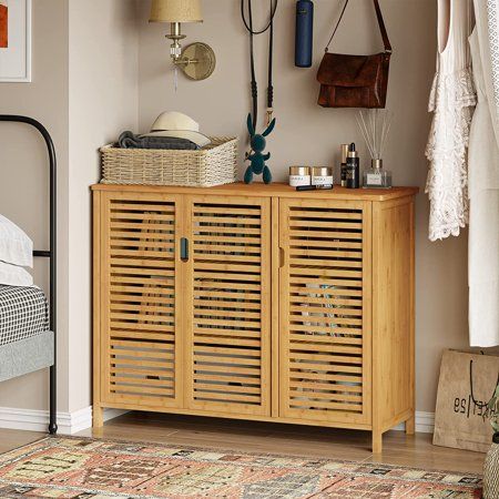 AMUZER Buffet Cabinet Sideboard with 3 Louvered Doors This bamboo buffet cabinet is an integrated cupboard with 2 storage cabinets, which can provide more hiden space to stored your private items.Besides,the classic and modern design with shutter doors can create a clean and tidy environment for you. Its natural color can be perfectly matched with any room decoration, making it more design and modern! Fitting perfectly into any space like the entryway, living room, and balcony. Specification: Ma Brown Sideboard, Cupboard Makeover, Room Necessities, Louvered Doors, Cabinet Buffet, Kitchen Storage Cabinet, Louvered Shutters, Kitchen Cupboard Storage, Cabinet Sideboard