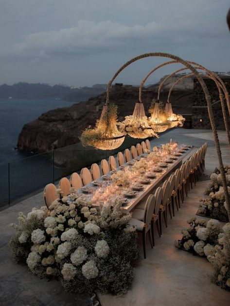 An abundance of white florals complements this romantic wedding reception in Santorini | wedding, wedding inspo, wedding decor ideas, wedding decor, intimate wedding, wedding reception, wedding reception decor, destination wedding, Santorini wedding, romantic wedding decor, romantic wedding, wedding reception ideas, wedding tablescapes, wedding table decor, wedding table centerpieces, luxury wedding reception, white wedding, wedding flowers, wedding floral designs #wedding #weddingreception Santorini Wedding Venue, Seating Arrangement Wedding, Wedding Jitters, Mykonos Wedding, Destination Wedding Italy, Wedding In Greece, Romantic Wedding Receptions, Beautiful Wedding Reception, Intimate Wedding Reception