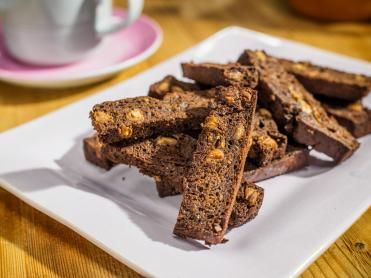 Banana Bread Biscotti Recipe | Food Network Banana Bread Honey, The Kitchen Food Network, Easy Does It, Biscotti Recipe, Chocolate Banana Bread, Chocolate Chip Banana Bread, Food Channel, Banana Chocolate Chip, Kitchen Food