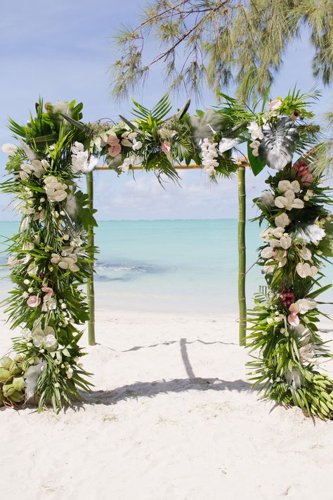 A greenery wedding arch on Mauritius beach with a turquoise sea backdrop - perfect for a small wedding. . . . Venue- Mauritius Model- @chantelrouhotas Photographer- @schantelmerwe Venue- @fsmauritius Styling, Décor and Flowers - @ontrendstylevents . #ontrend #destinationweddingplanner #wowfactor #weddingplanner #events #eventplanner #stylist #floralarrangements #luxewedding #instagood #mauritius #natural #weddingvenue #eventinspiration #flowers #lifestyleshoot Mauritius Wedding Beach, Beach Style Flower Arrangements, Mauritius Wedding, Mauritius Beach, Wedding Doors, Wedding Beach Ceremony, Luxe Wedding, Outdoor Wedding Decorations, Destination Wedding Planner