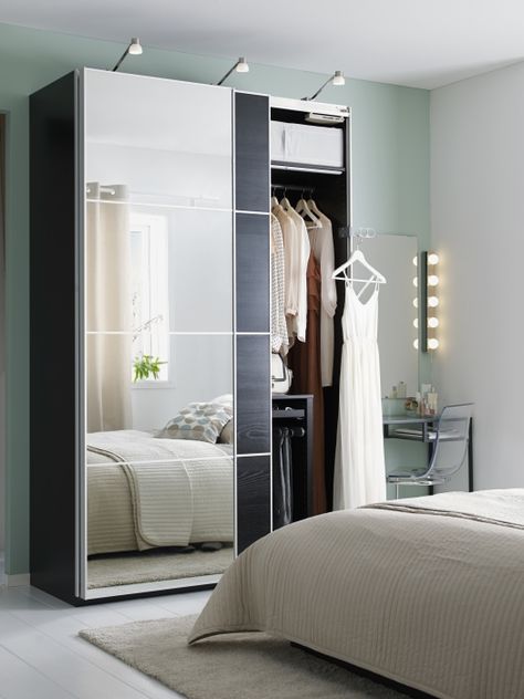 Mirrored wardrobe doors, like AULI for PAX, are clever small space multi-taskers. They hide your clothes and reflect light to make your room feel larger, all while taking up no extra wall space! Studio Apartment Closet, Ikea Armoire, Dressing Ikea, Mirrored Wardrobe Doors, Armoire Ikea, Mirror Closet, Armoire Design, Design Ložnic, Ikea Wardrobe