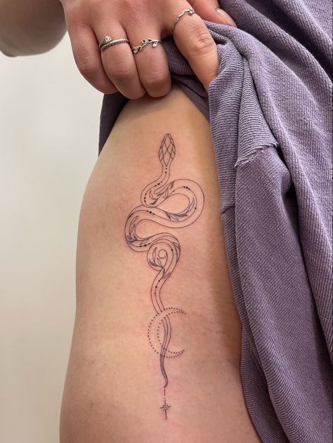 Fineline snake tattoo Snakes And Vines Tattoo, Snake With Stars Tattoo, Snake Nature Tattoo, Pretty Snake Tattoos For Women, Wrap Around Wrist Tattoos Snake, Snake Tattoo On Stomach For Women, Dainty Snake Spine Tattoo, Snake On Ribs Tattoo, Year Of Snake Tattoo