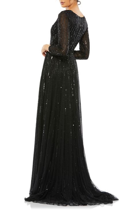 Look like you just stepped off the red carpet in this plunging V-neck gown illuminated with stripes of glittering sequins and light-catching beads. 63" length Deep V-neck Long sleeves Lined, except sleeves 100% polyester Spot clean Imported Asian Owned/Founded Vestidos Color Coral, Designer Formal Dresses, Mesh Gown, Evening Gowns With Sleeves, Plastic Dress, A Line Evening Dress, Exquisite Gowns, Long Sleeve Gown, Long Sleeve Sequin