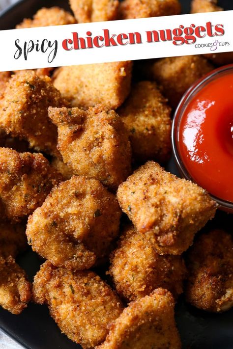 Crunchy on the outside, tender and flavorful, these Spicy Chicken Nuggets are way better than fast food! Make them at home and dip in Sriracha Ketchup! #cookiesandcups #spicychickennuggets #chickennuggets #chickenrecipe Spicy Nuggets, Spicy Chicken Nuggets, Fried Chicken Nuggets, Dipping Sauces For Chicken, Cookies And Cups, Rice And Chicken, Homemade Chicken Nuggets, Spicy Chicken Sandwiches, Sweet And Spicy Chicken