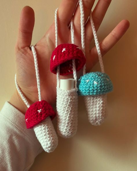 These crocheted mushroom lip balm holders were such a fun commission project and are such a great gift idea! They were so quick and easy to whip up too! Maybe I’ll do a tutorial? 👀 . . . #crochetmushroom #mushroomcrochet #crochetaccessories #lipglossholder #lipbalmholder Crochet Mushroom Person, Crochet Lip Balm Holder Pattern Free, Lip Balm Keychain Diy, Mushroom Lip Balm Holder, Crochet Lip Balm Holder, Crochet Lip Balm, Crocheted Mushroom, Lip Balm Keychain, Crochet Mushroom