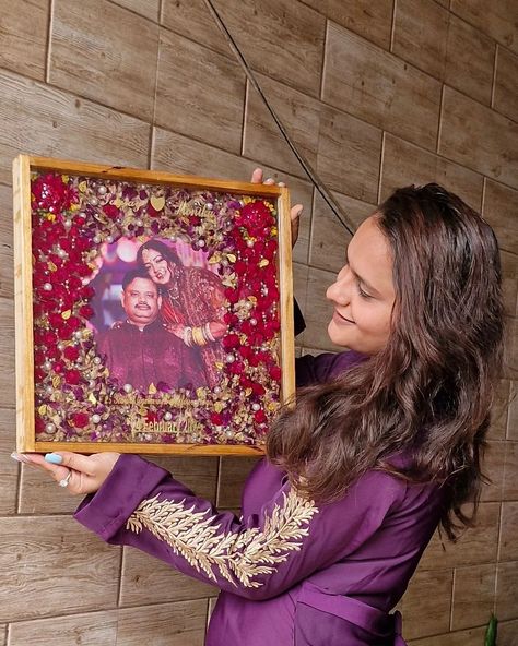 I am delighted to share this beautiful teakwood frame preserved with a vibrant pair of kaleeras and a varmala. It was created as a 25th-anniversary gift from a daughter to her parents, and I am thrilled to report that they were overjoyed with the result.✨️���🧿 The feedback from the client was incredibly positive, and it brought me immense joy to know that my creation was so well-received. Both the daughter and her parents expressed their love for the frame, and I am proud to have been a part of... Flowers Varmala, Wedding Preservation, 25th Anniversary Gift, A Daughter, The Client, How To Preserve Flowers, 25th Anniversary, Resin Crafts, Anniversary Gift