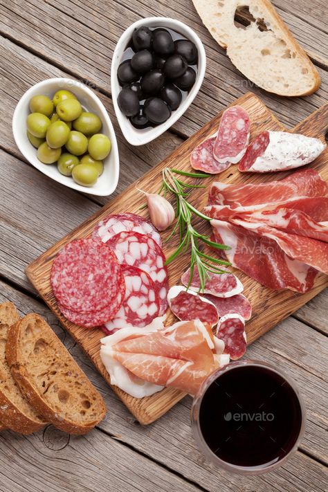 Salami, ham, sausage, prosciutto and wine by karandaev. Salami, sliced ham, sausage, prosciutto, bacon, toasts, olives. Meat antipasto platter and red wine on wooden table. ...#karandaev, #wine, #bacon, #sliced Antipasto Appetizer, Antipasto Platter, Wine And Cheese Party, Toast Toppings, Charcuterie Platter, Sliced Ham, Party Food Platters, Charcuterie And Cheese Board, Cured Meats