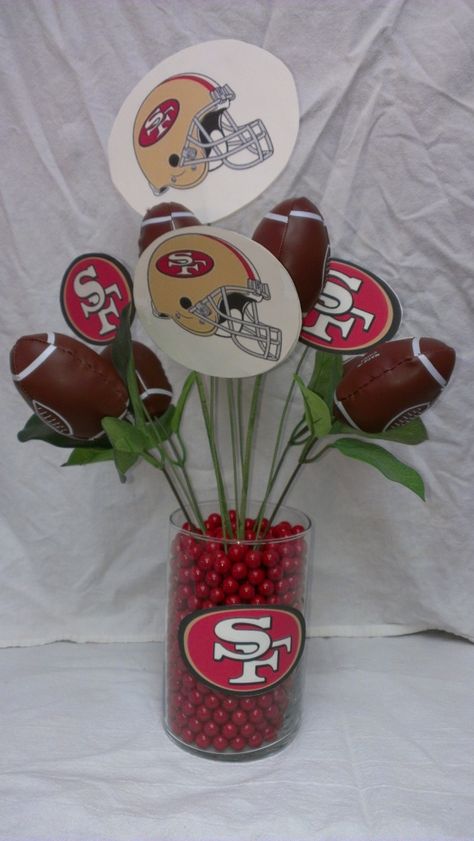 Super cute San Francisco 49ers inspired arrangement. 49ers Centerpieces Party Ideas, Super Bowl Party Decorations 49ers, 49ers Party Ideas, 49ers Birthday Party Decorations Football Themes, 49er Party Decorations, Football Dinner Centerpieces, 49ners Birthday Ideas, Elegant Football Banquet Centerpieces, 49er Party