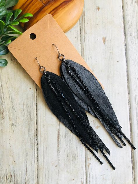 Black Crystal chain leather feather earring/boho leather dangle earring/long leather earring/feather chain earring Boho shabby chic! Black long feather, black crystal chain leather feather dangle earrings.Super light and ready to wear!  Gunmetal Hooks are lead and nickel free .Ready to sell will ship out same or next day in a gift box with tracking:) thanks for looking at my shop:) How To Make Jewelry To Sell, Diy Boho Earrings, Diy Feather Earrings, Diy Leather Feather Earrings, Silhouette Jewelry, Leather Feather Earrings, Boho Jewelry Diy, Earring Long, Handmade Leather Jewelry