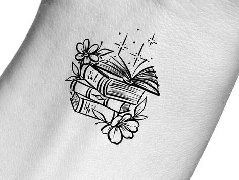 Book And Mug Tattoo, Girly Book Tattoo, Book Tattoo Wrist, Line Art Book Tattoo, Readers Tattoo Ideas, Small Book Tattoos For Women, Cute Book Tattoos, Small Bookish Tattoos, Books And Flowers Tattoo