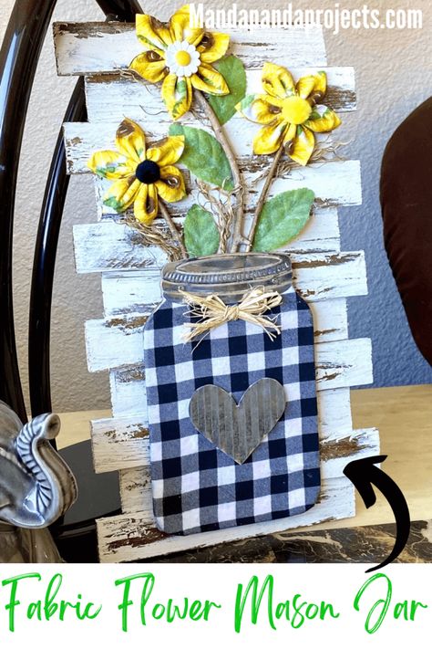 The sun is shining and It feels like Summer with this Fabric Sunflower Mason Jar decor, but this craft could totally be displayed year round! Take a Dollar Tree wooden mason jar and give it cheerful crafty makeover with some fabric, sticks from your yard, wooden shims and good ‘ole cardboard. You had me at “Sunflower”! #sunflowerdecor Classy Crafts, Sunflower Mason Jar, Mason Jar Art, Mason Jar Sign, Sunflower Crafts, Mason Jar Decor, Feels Like Summer, Jar Decor, Mason Jar Crafts Diy