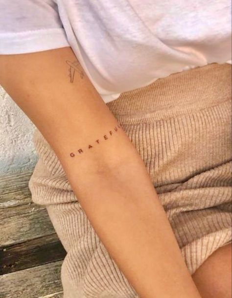 One Word Arm Tattoo, Above Elbow Tattoos For Women Words, Lala Tattoo, Minimalist Arm Tattoos For Women, Tiny Arm Tattoos For Women, Behind Arm Tattoo, Inner Elbow Tattoos For Women, Above Elbow Tattoos For Women, Discrete Tattoo Placement