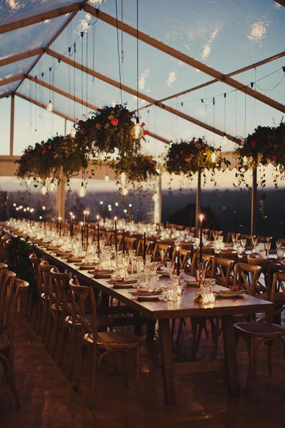 Warm lighting and draped foliage set the mood for ethereal elegance. Coupled with a translucent tent that mirrors the night sky, this space is like a midsummer night's dream. Window Desk, Marriage Ideas, Deco Champetre, 카페 인테리어 디자인, Outdoor Wedding Decorations, Tent Wedding, Wedding Goals, Reception Ideas, Wedding Guide