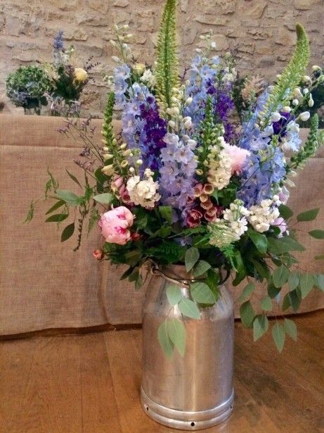 Bristol florist The Rose Shed shows wedding flowers at Folly Farm. Reception Arrangements, August Wedding Flowers, Farm Flowers, Church Wedding Flowers, Fresh Wedding Flowers, Bristol Wedding, Milk Churn, Cheap Wedding Flowers, Tropical Wedding Flowers